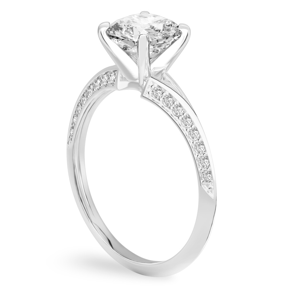 Angle view of cushion cut diamond split shank knife edge engagement ring in white gold