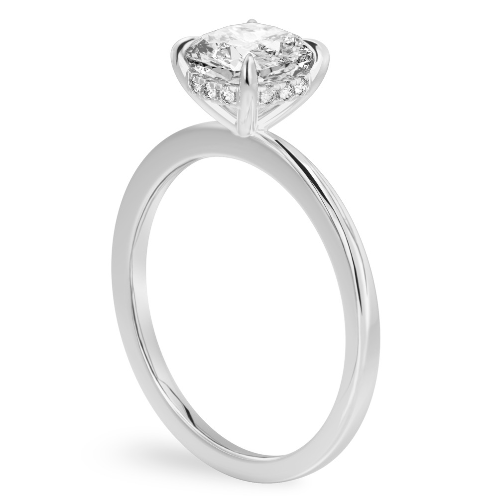 Angle view of cushion cut diamond hidden halo engagement ring in white gold