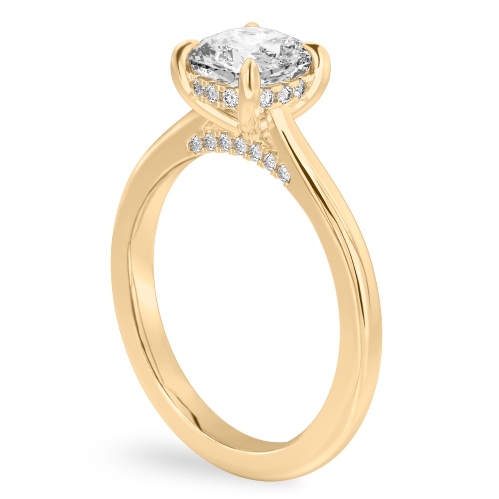 Angle view of cushion cut diamond pave bridge engagement ring in yellow gold