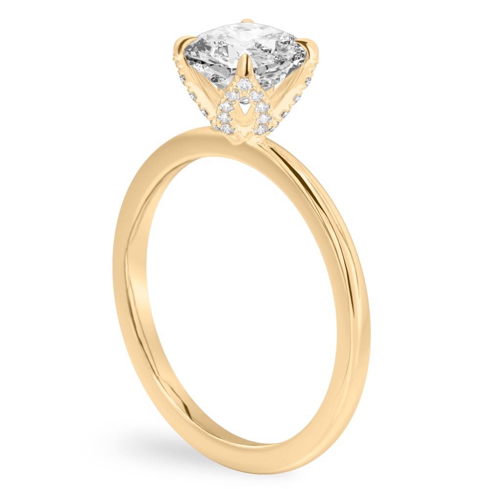 Angle view of cushion cut diamond pave petal prong engagement ring in yellow gold