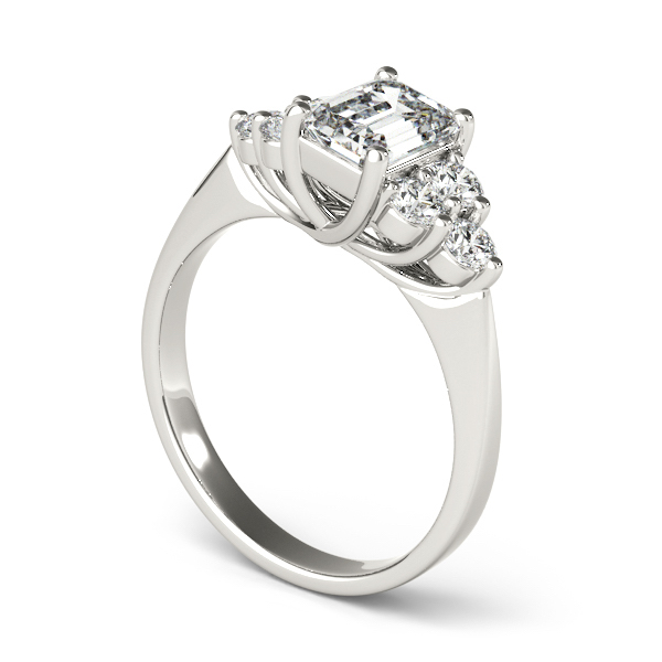 angle view of cluster side stone trellis engagement ring in white gold with emerald cut diamond