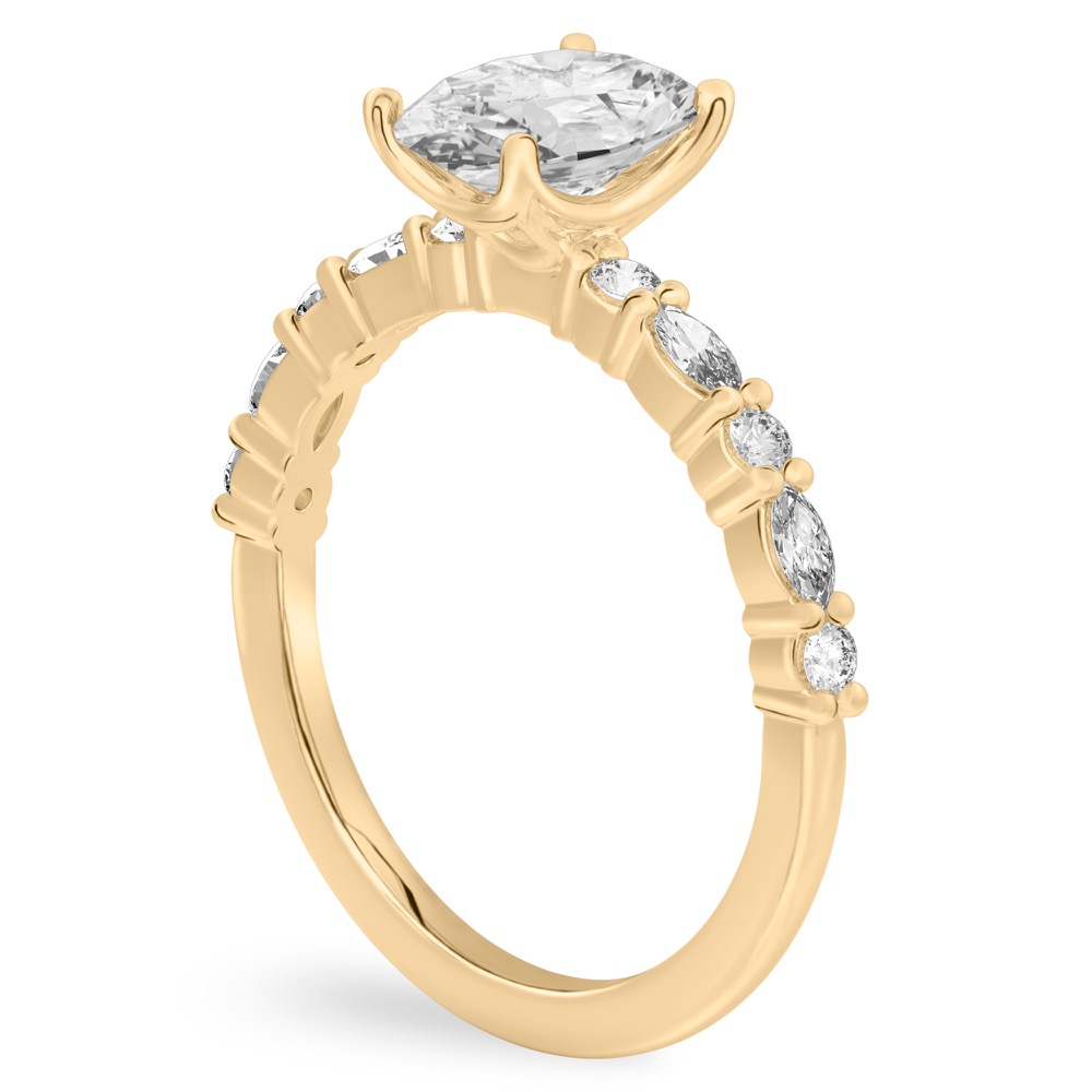 Angle view of oval cut diamond marquise and round diamond ring yellow gold