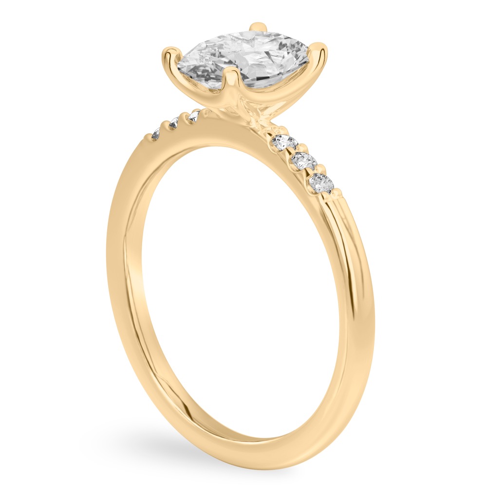 Angle view of oval cut diamond minimalist pave engagement ring in yellow gold