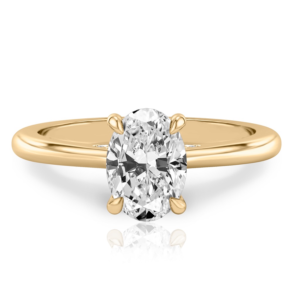 oval cut diamond pave bridge engagement ring in yellow gold