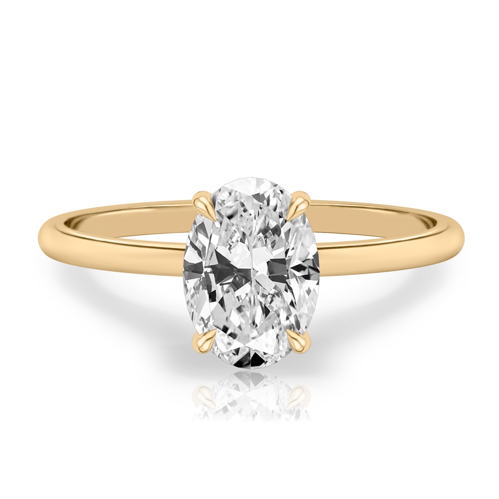 oval shape diamond delicate solitaire engagement ring in yellow gold