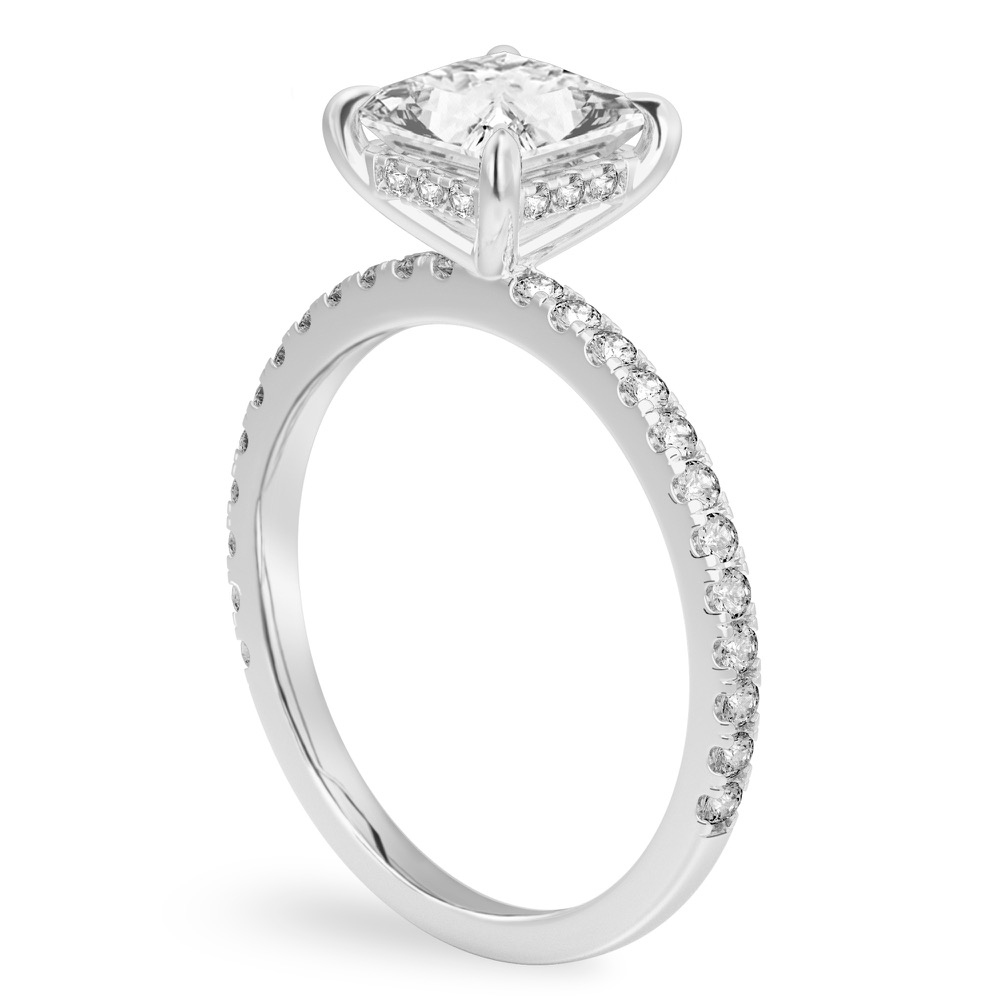 Angle view of princess cut diamond delicate pave hidden halo engagement ring in white gold