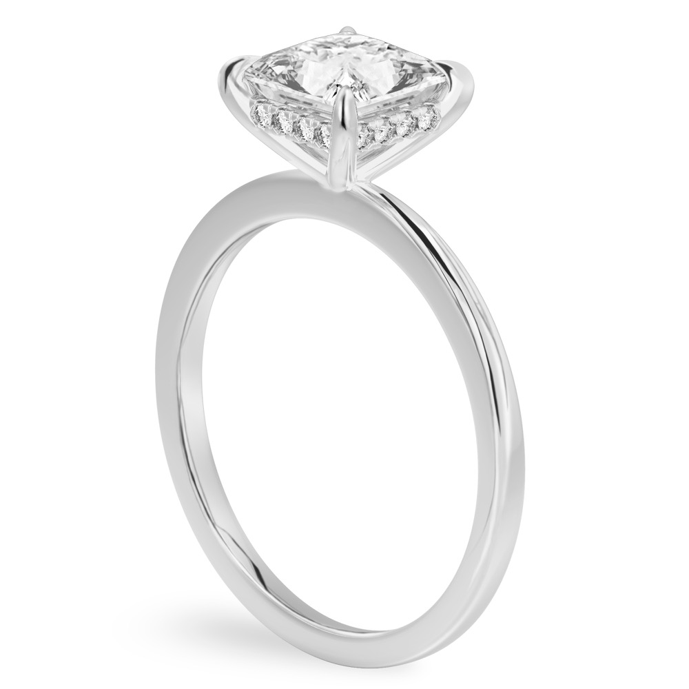 Angle view of princess cut diamond hidden halo engagement ring in white gold