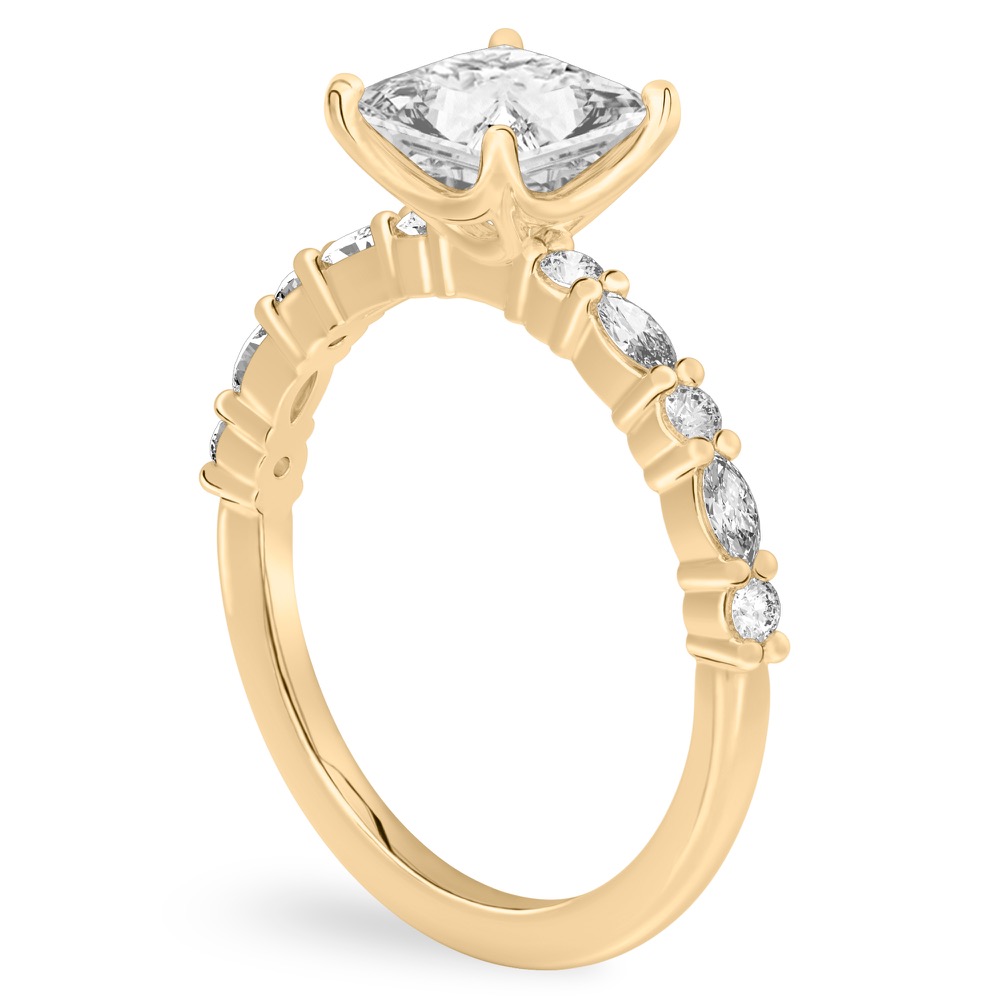 Angle view of princess cut diamond marquise and round diamond ring yellow gold