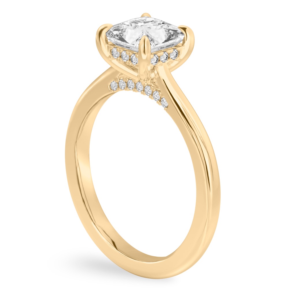 Angle view of princess cut diamond pave bridge engagement ring in yellow gold