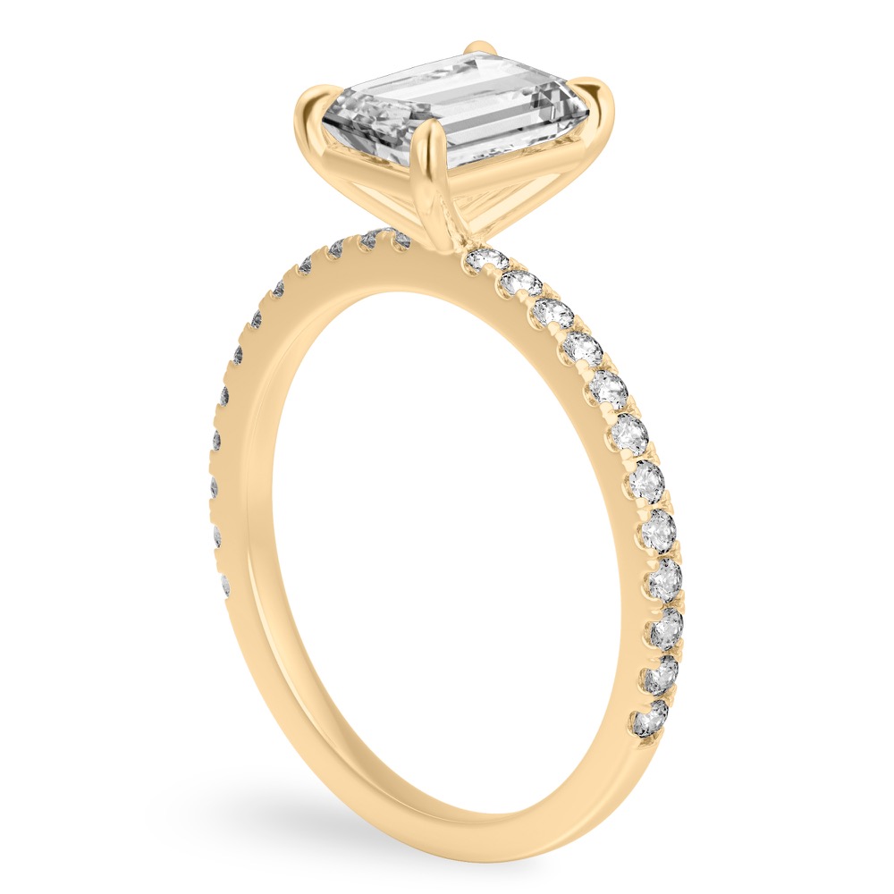 Angle view of radiant cut diamond delicate pave engagement ring in yellow gold