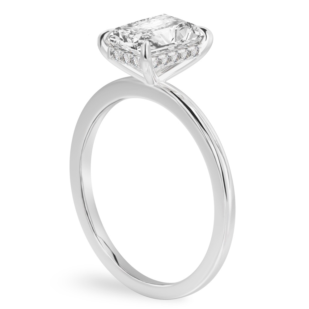 Angle view of radiant cut diamond hidden halo engagement ring in white gold