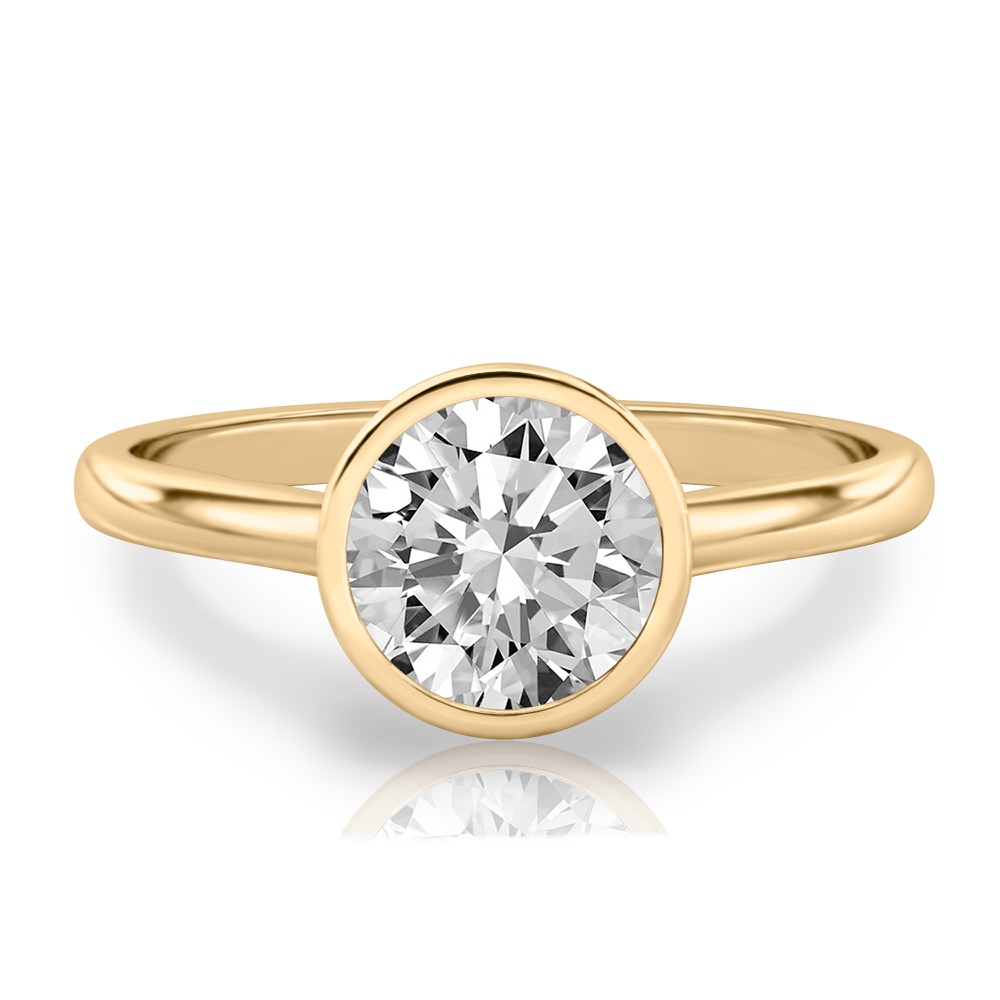 round cut diamond bezel engagement ring in yellow gold