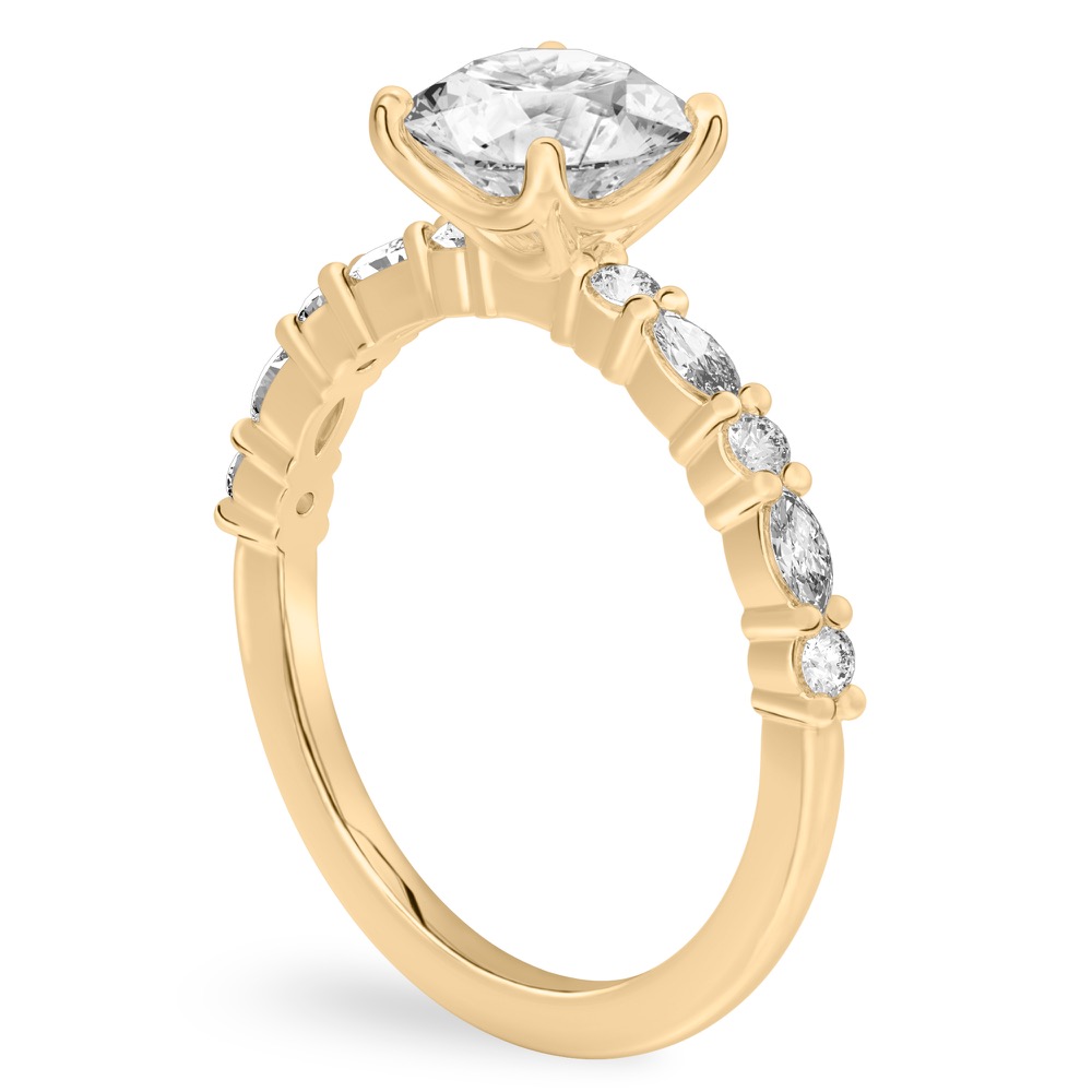 Angle view of round cut diamond marquise and round diamond ring yellow gold