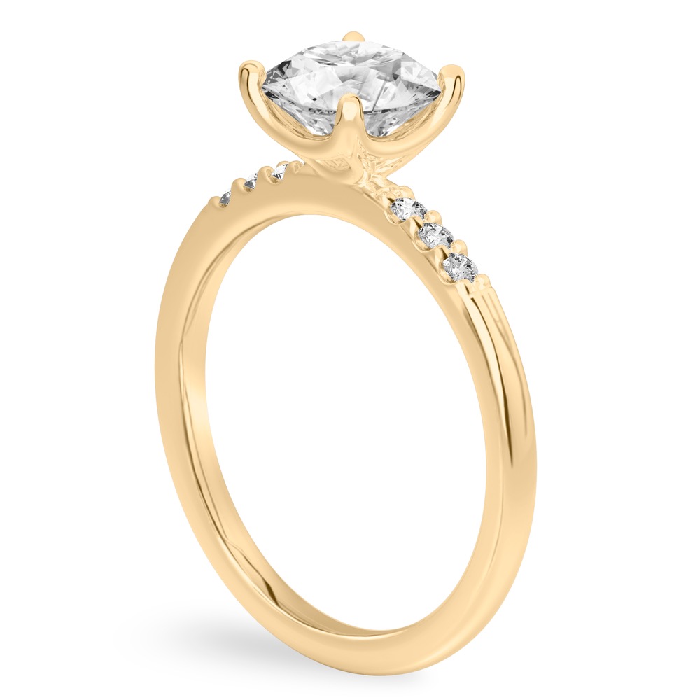 Angle view of round cut diamond minimalist pave engagement ring in yellow gold