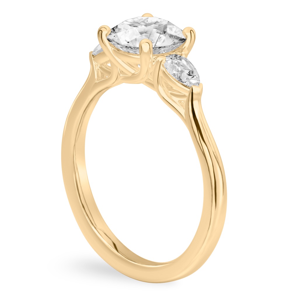 round cut diamond pear side stone engagement ring yellow gold angle