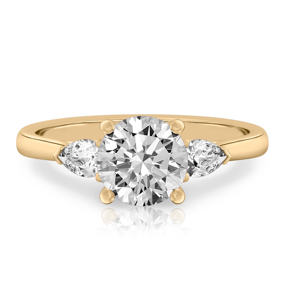 round cut diamond pear side stone engagement ring yellow gold