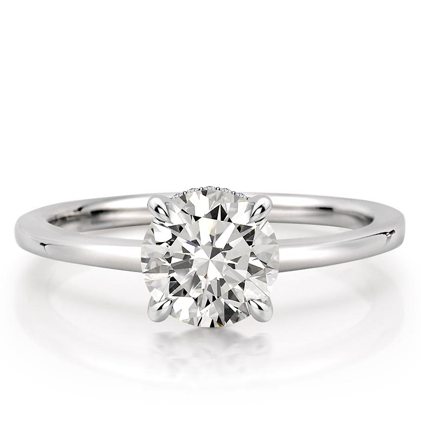 round cut diamond secret halo engagement ring in white gold