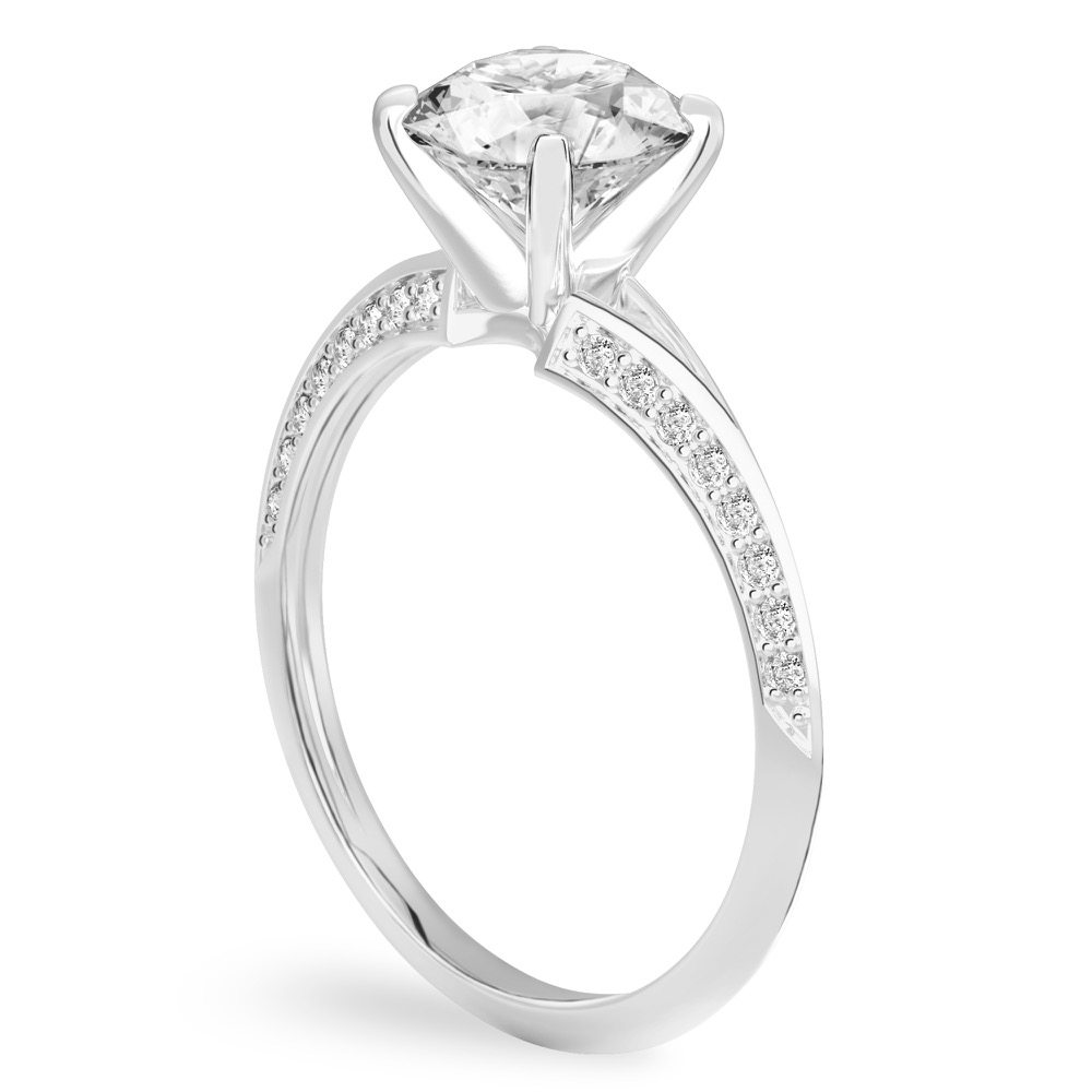 Angle view of round cut diamond split shank knife edge engagement ring in white gold