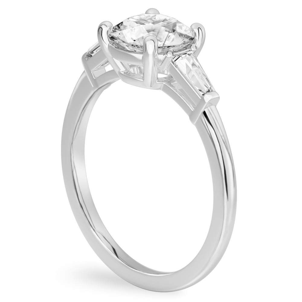 Angle view of round cut diamond tapered baguette engagement ring in white gold